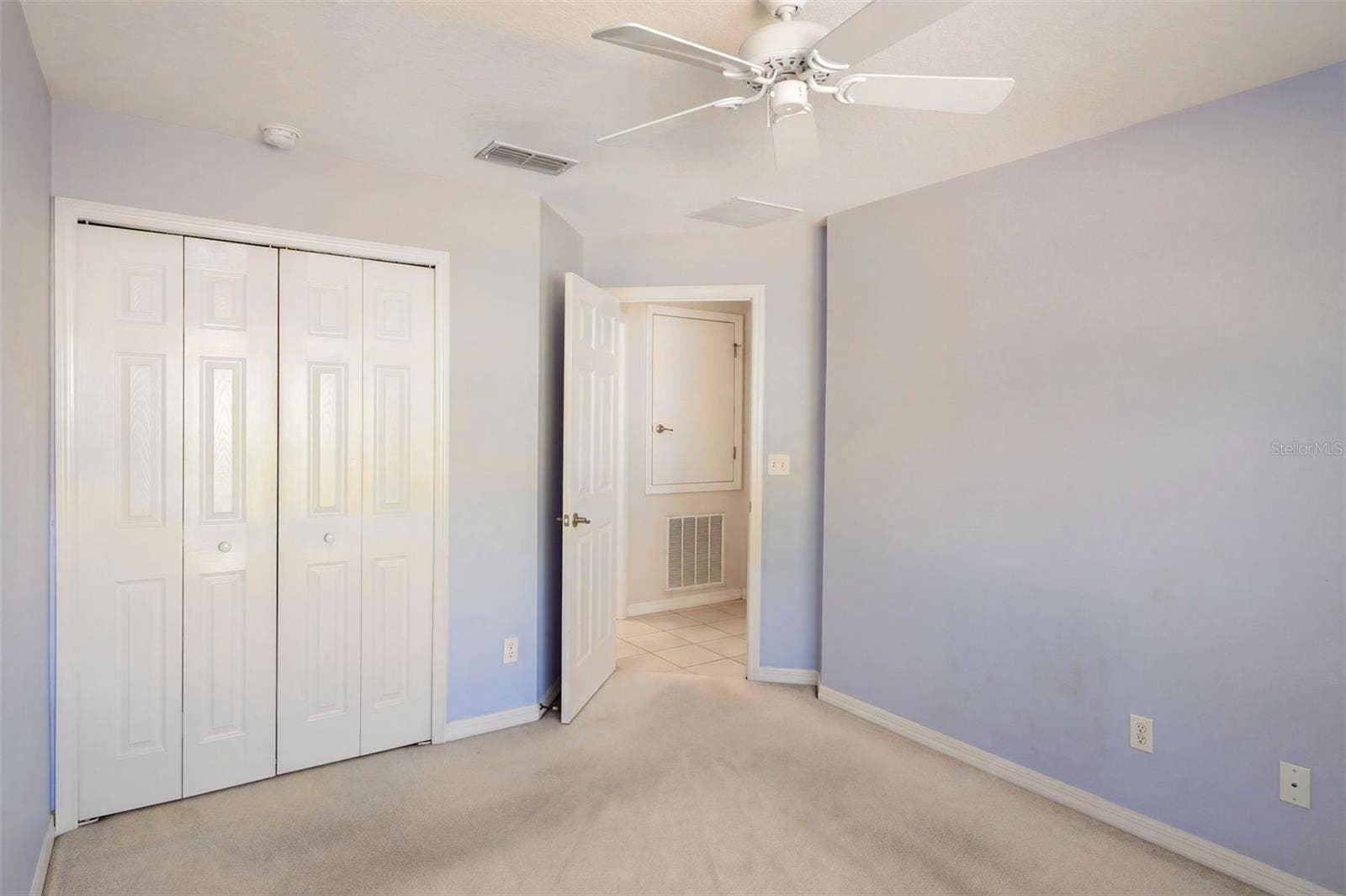 3437 GRENVILLE DRIVE, Winter Haven, FL 33884 Guest bedroom features a ceiling fan