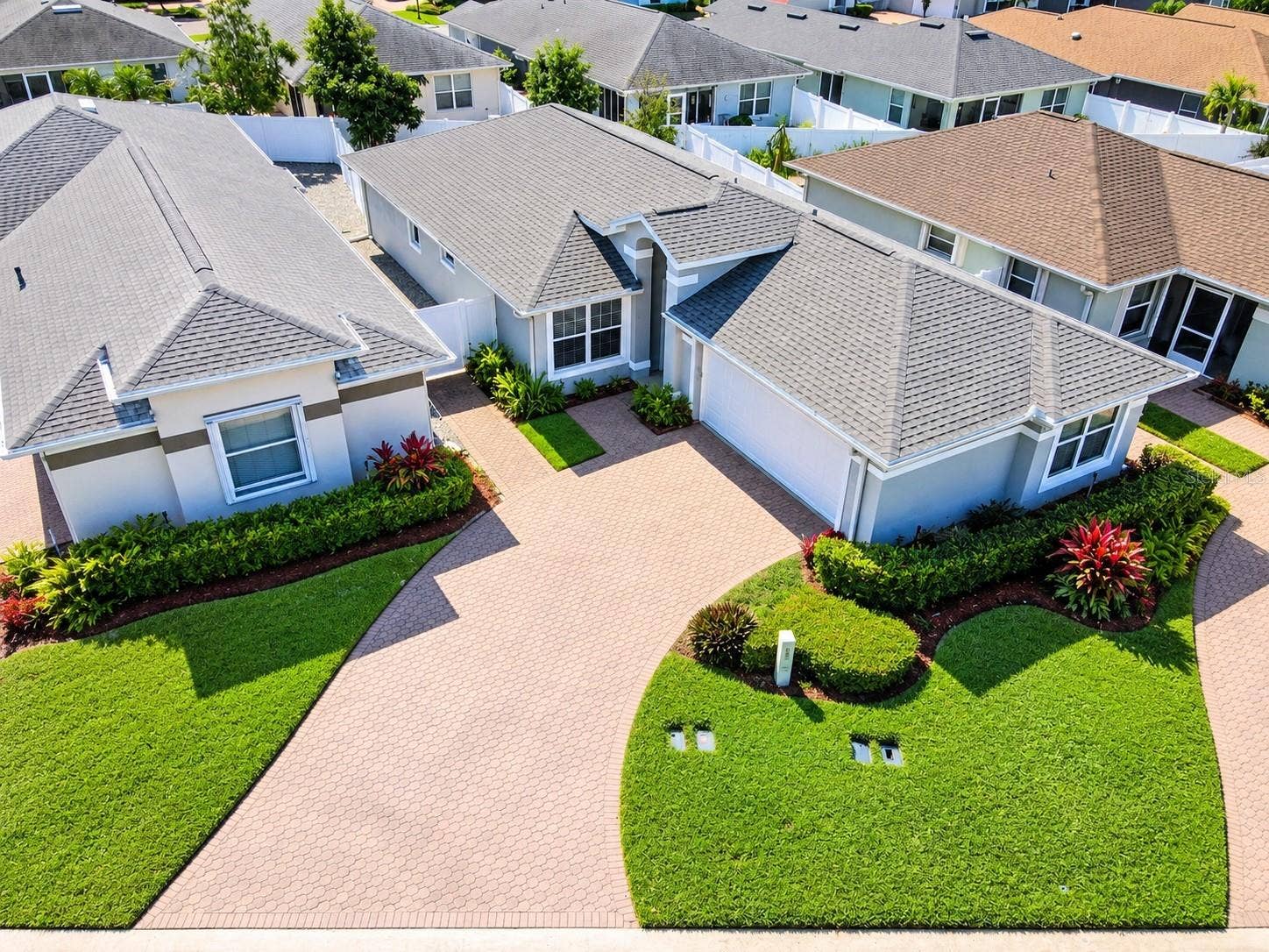 3437 GRENVILLE DRIVE, Winter Haven, FL 33884 Architectural shingle roof (2020), HVAC system (2017), exterior lighting, water softener system, gutters, a glass entry storm door, and a two-car garage.