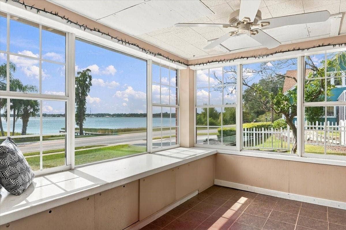 1501 N LAKE HOWARD DRIVE, Winter Haven, FL 33881 Wrap-around windows in sunroom