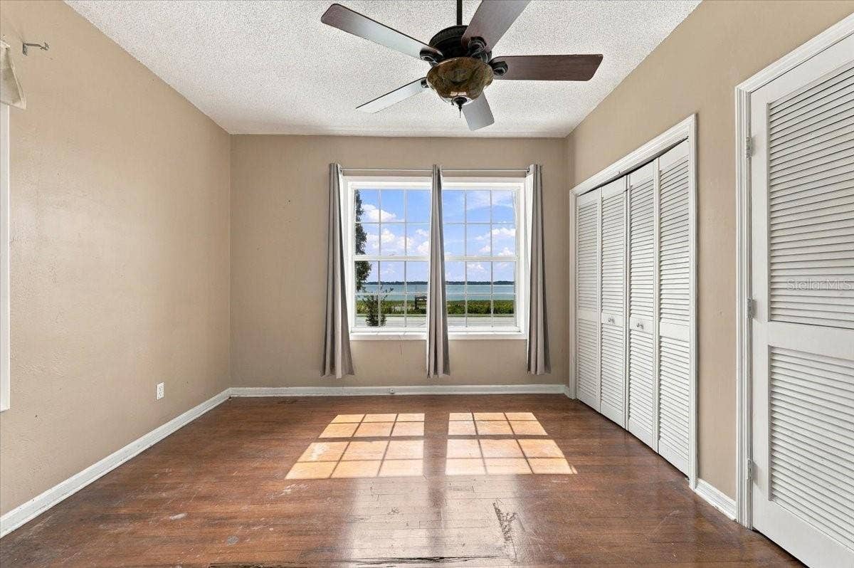 1501 N LAKE HOWARD DRIVE, Winter Haven, FL 33881 Primary Bedroom has lake views