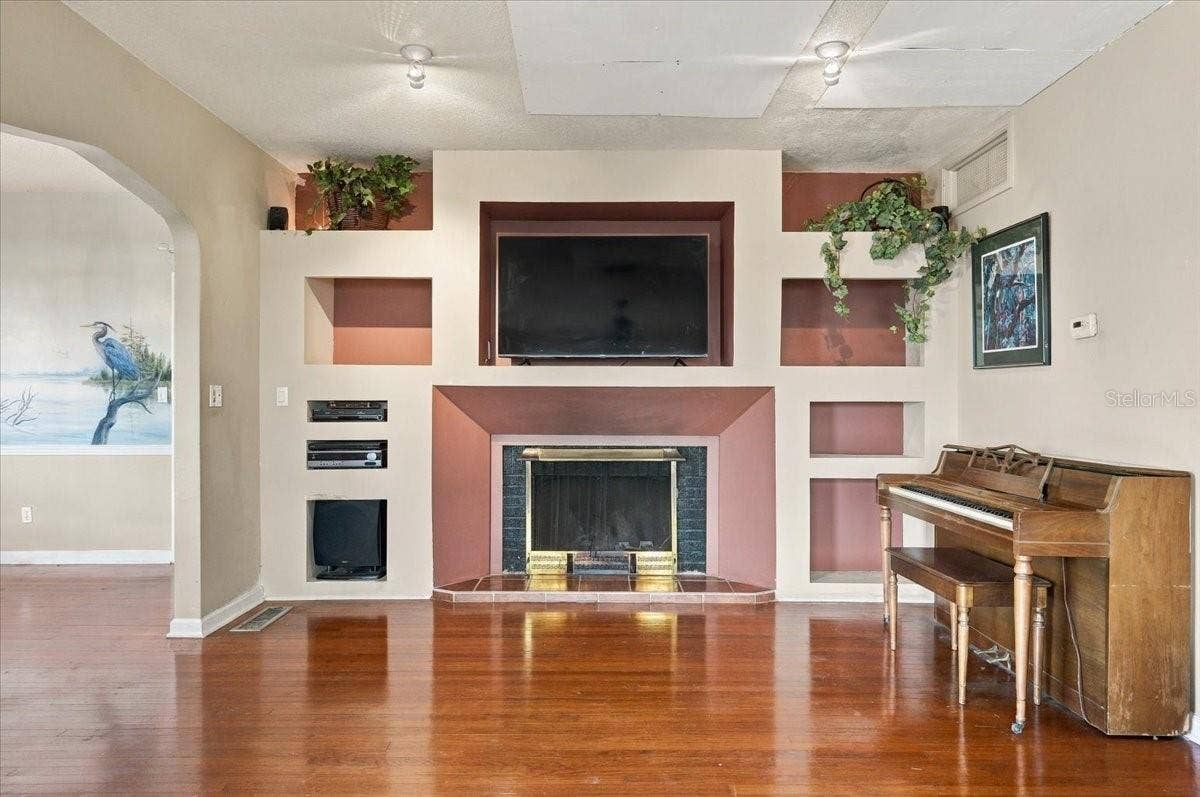 1501 N LAKE HOWARD DRIVE, Winter Haven, FL 33881 wood-burning fireplace w built-in shelving