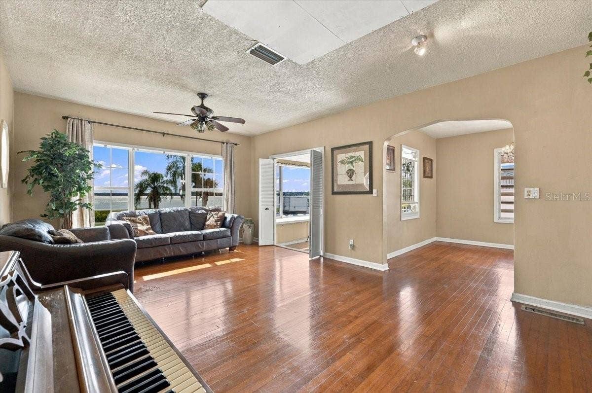 1501 N LAKE HOWARD DRIVE, Winter Haven, FL 33881 Living room w original hardwood floors