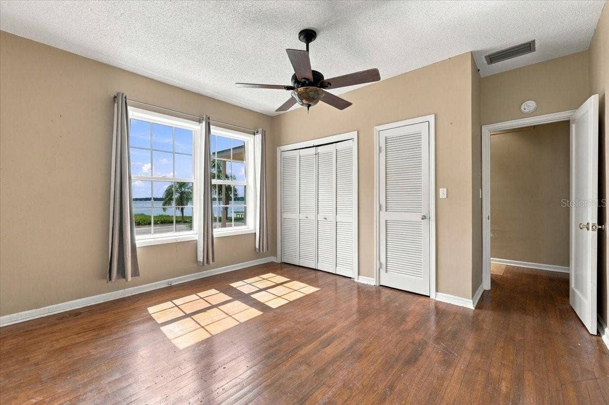 1501 N LAKE HOWARD DRIVE, Winter Haven, FL 33881 Primary Bedroom has lakefront views