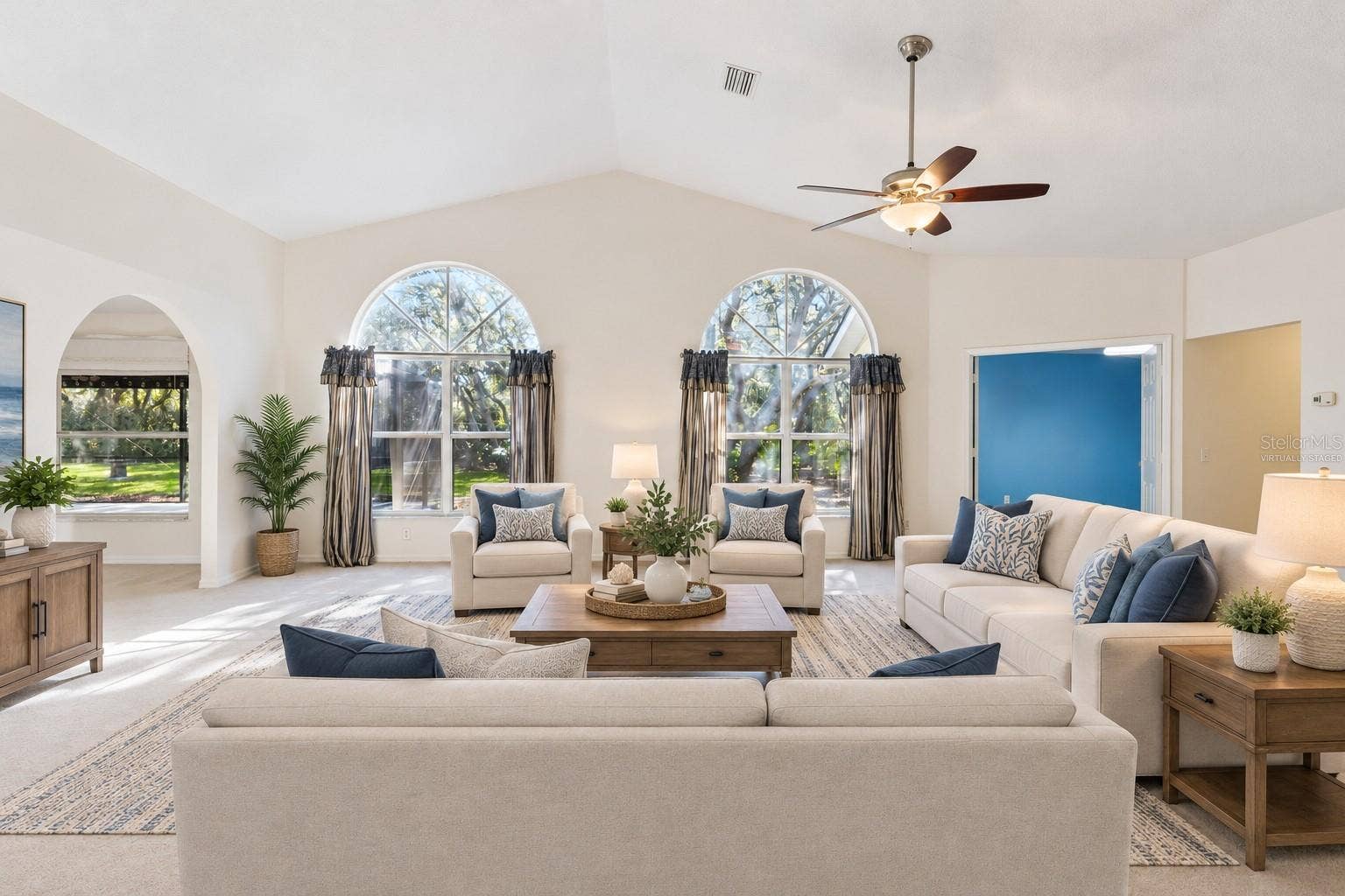 Virtually Staged Living Room with Large Arched Windows