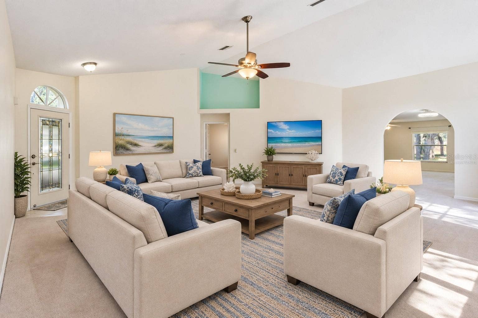 Virtually Staged Living Room featuring Vaulted Ceilings and Decorative Planter Shelf
