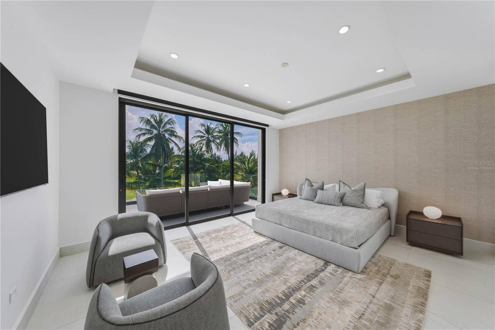 G8 ATLANTIC DRIVE, 7000 BAHIA BEACH BLVD., Rio Grande, PR 00745 Guest Bedroom - The terrace that connects to the bedroom in this image has been virtually staged and does not reflect the current state of the property.