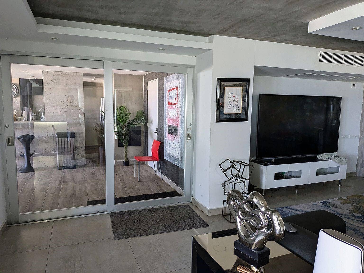 305 CALLE VILLAMIL, #PH 2001, San Juan, PR 00907 Living area glass sliders to covered terrace