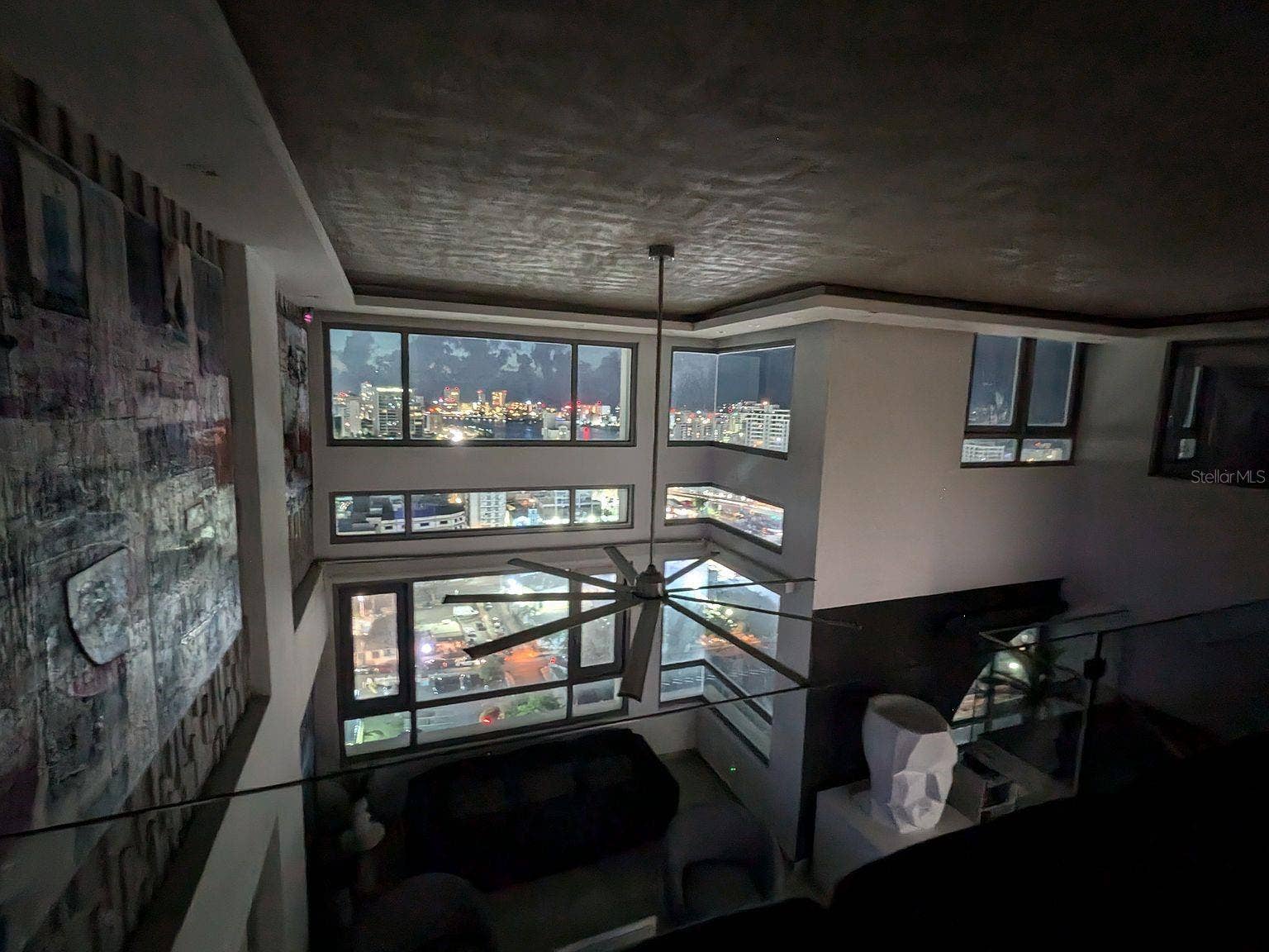 305 CALLE VILLAMIL, #PH 2001, San Juan, PR 00907 Living room night city views from loft