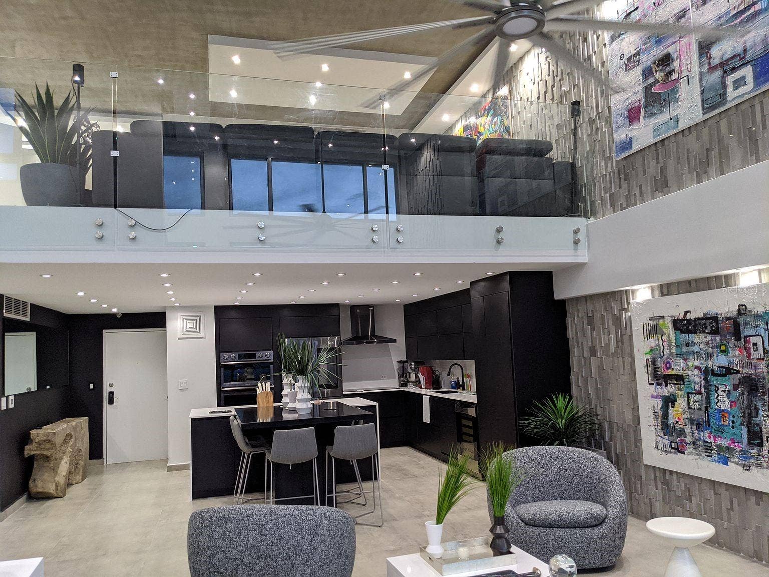 305 CALLE VILLAMIL, #PH 2001, San Juan, PR 00907 Kitchen and living glass-rail loft above
