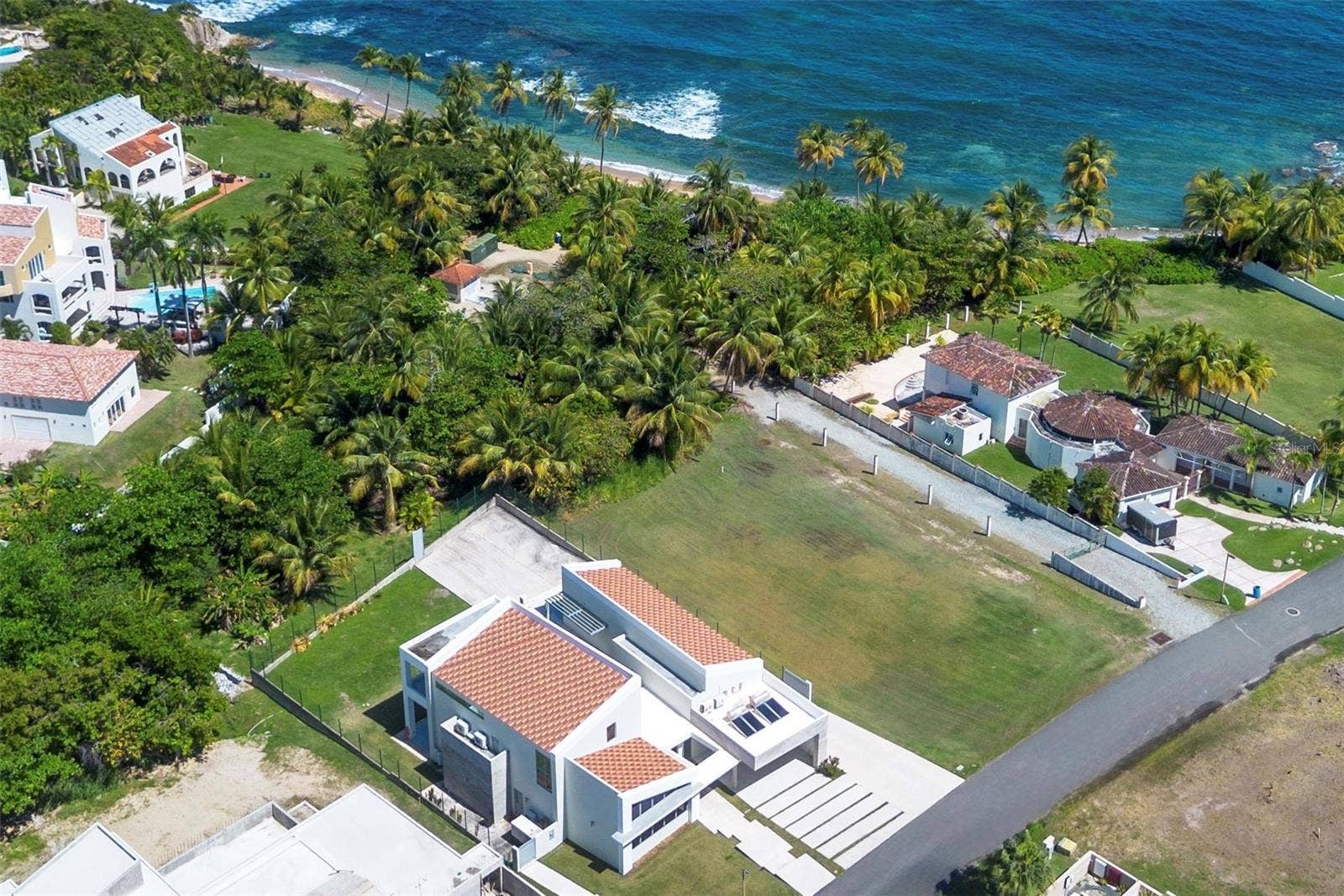 13 HOON SHELL ROAD | SURFSIDE, Humacao, PR 00791 A rare beach-level setting on Hoon Shell Road, steps from a quiet sandy cove.