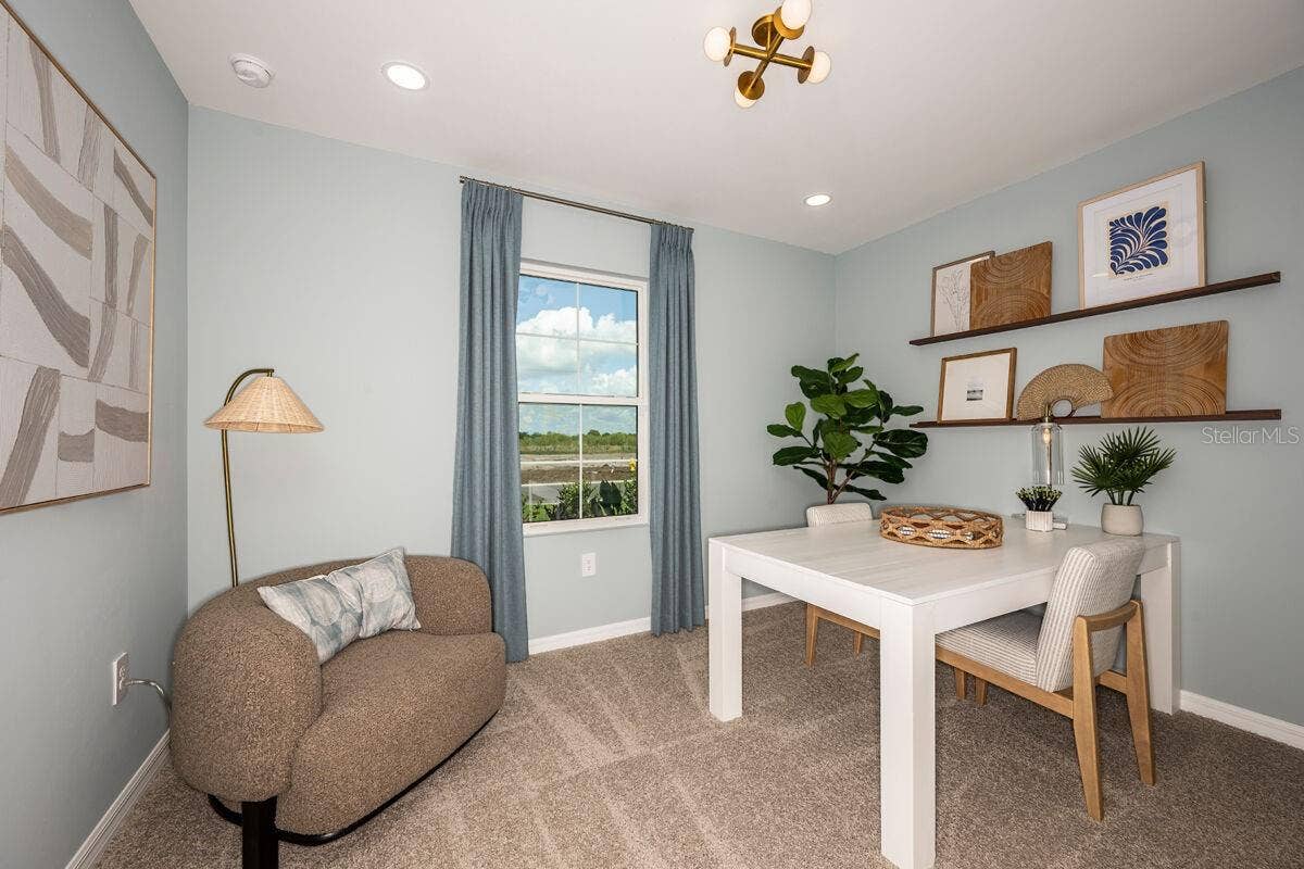 Den-Photo description represents the model home of same floor plan.