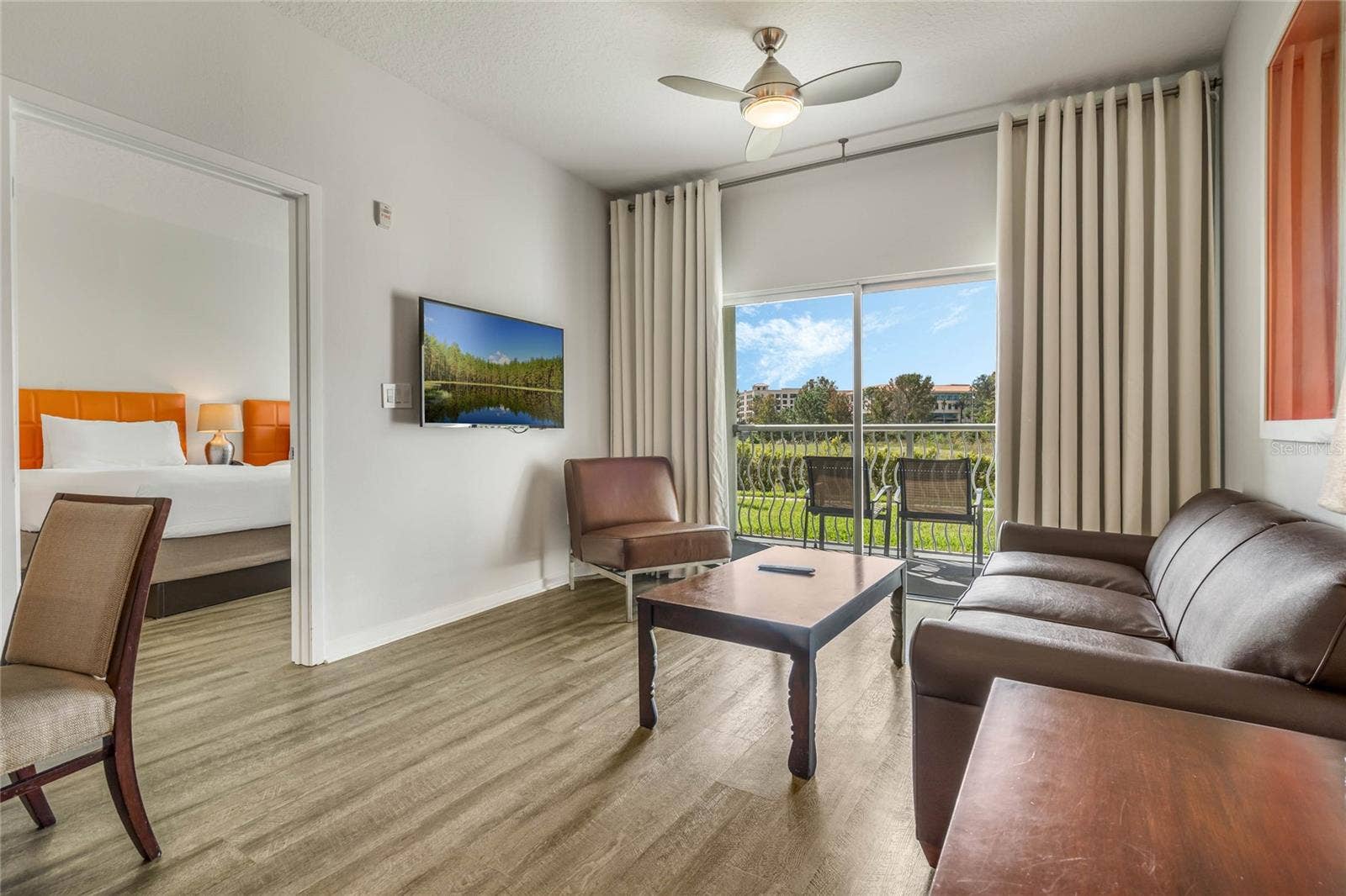 225 CELEBRATION PLACE, #117, Celebration, FL 34747 Living Room to 2nd Bedroom