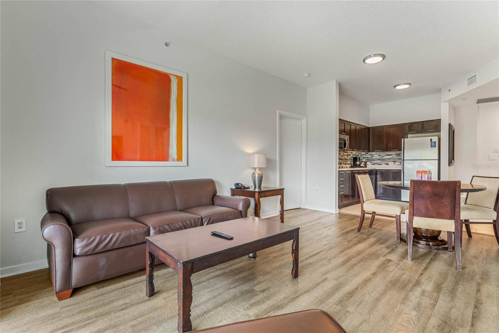 225 CELEBRATION PLACE, #117, Celebration, FL 34747 Living Room to Kitchen