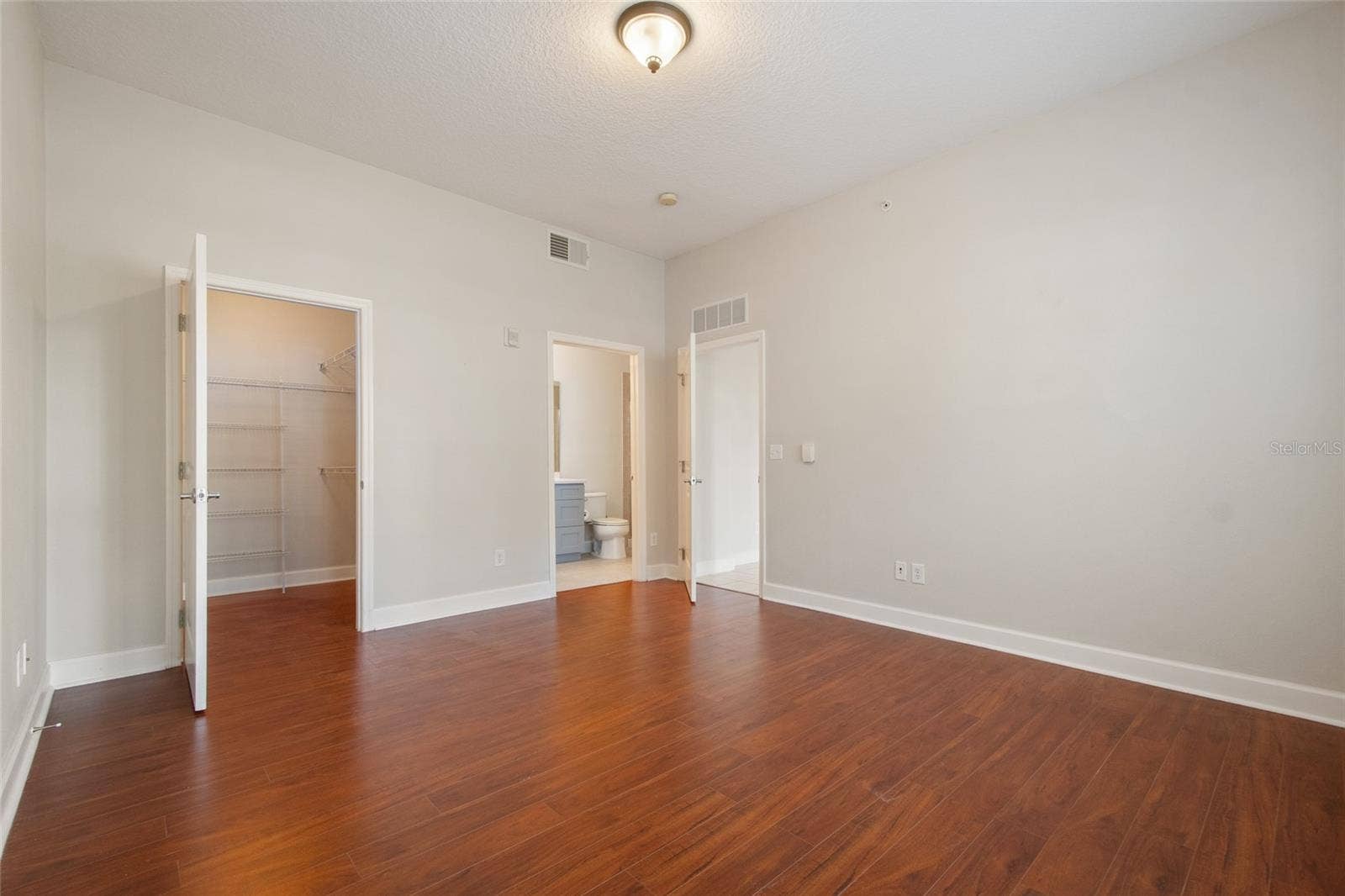 1410 CELEBRATION AVENUE, #102, Celebration, FL 34747 PRIMARY CLOSET AND BATHROOM