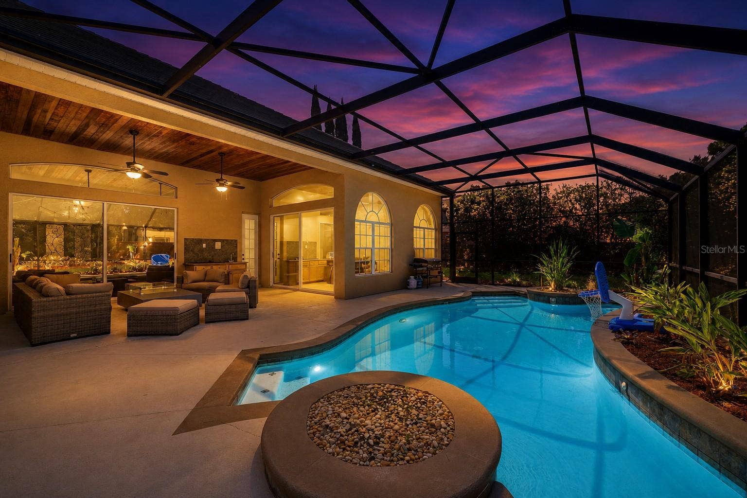 9119 BALMORAL MEWS SQ, Windermere, FL 34786 Twilight Covered and Screened in Patio & Pool