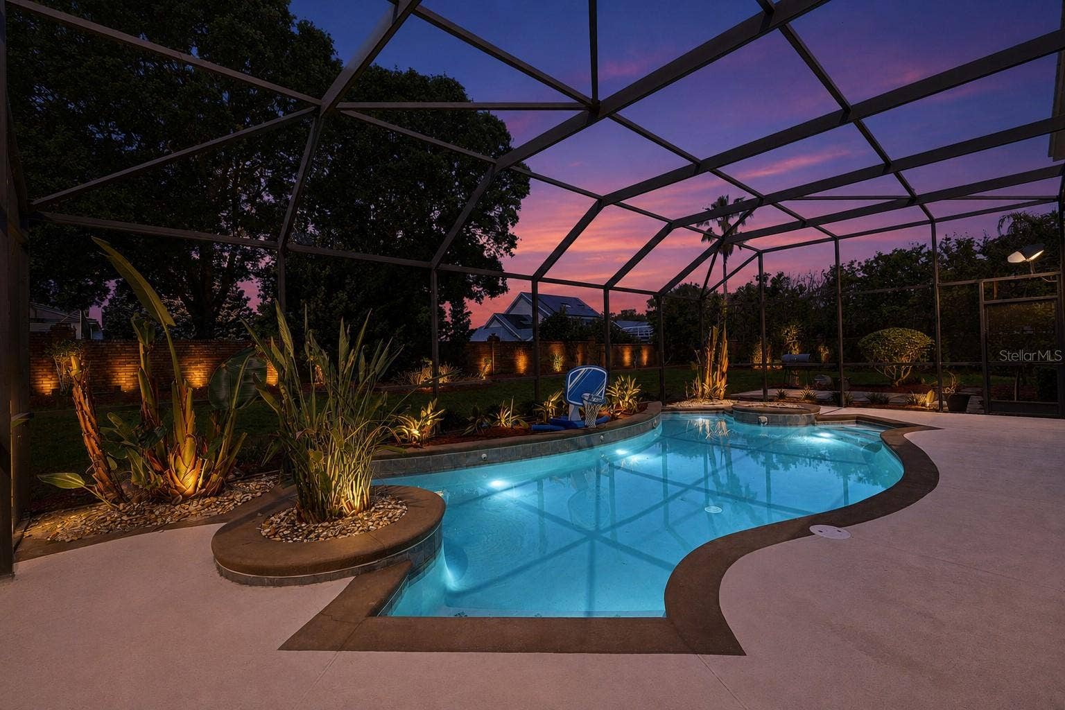 9119 BALMORAL MEWS SQ, Windermere, FL 34786 Twilight Covered and Screened in Patio & Pool