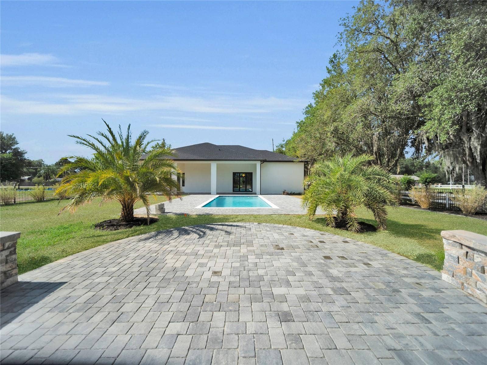 11241 OSWALT ROAD, Clermont, FL 34711 Outdoor entertaining area overlooking pool