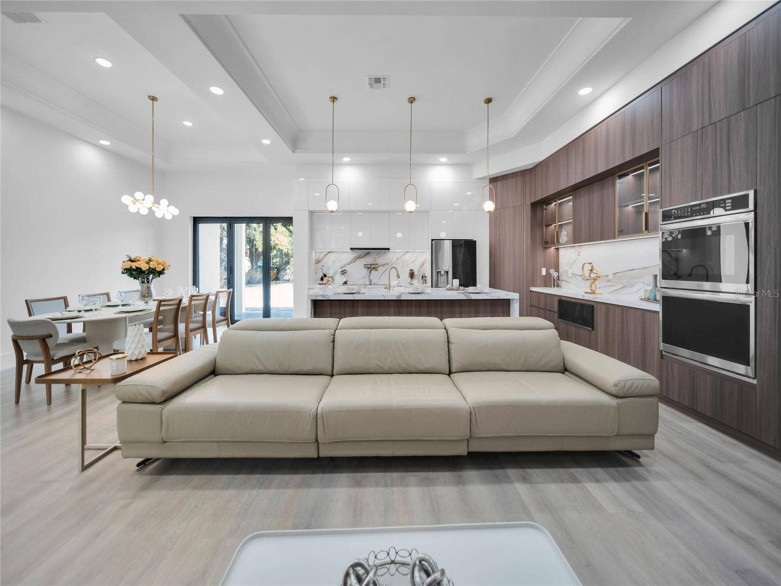 11241 OSWALT ROAD, Clermont, FL 34711 Spacious living area with custom feature wall