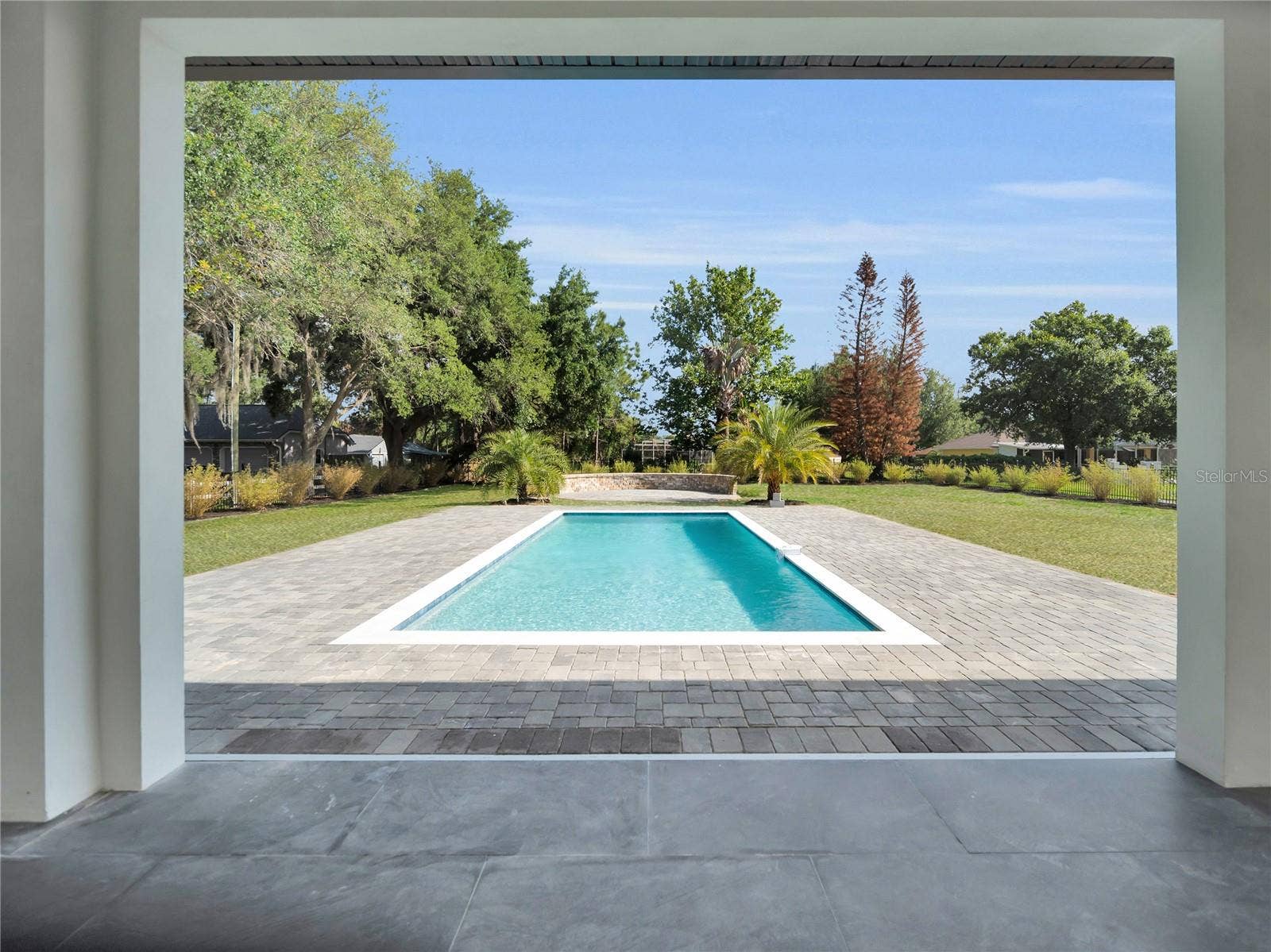 11241 OSWALT ROAD, Clermont, FL 34711 Covered lanai with pool views