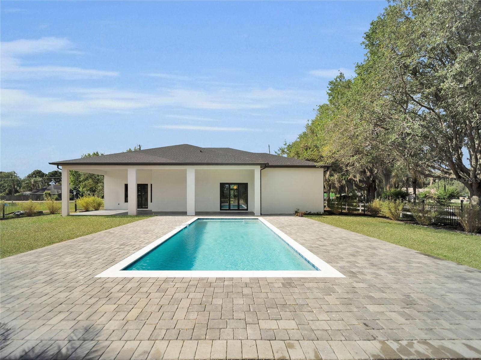 11241 OSWALT ROAD, Clermont, FL 34711 Pool with covered outdoor living access