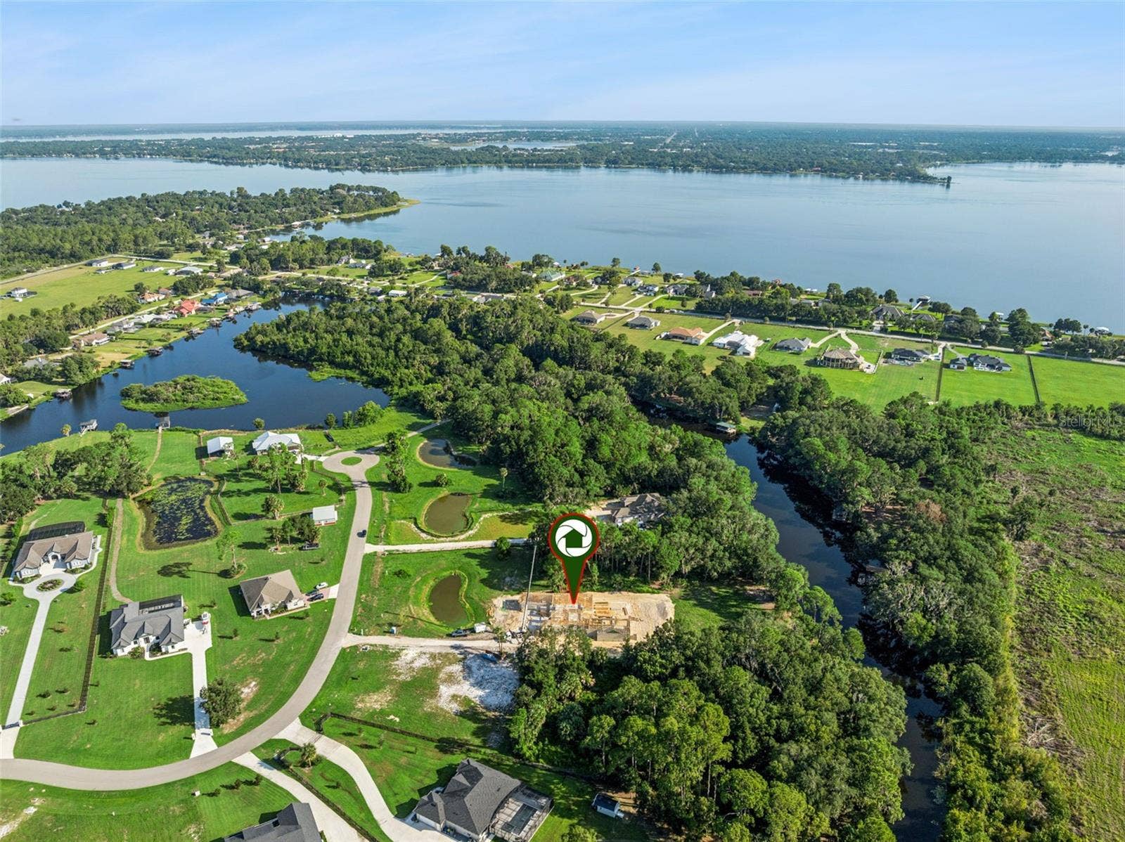 3654 HIDDEN RIVER LANE, Tavares, FL 32778 Overlooking the home and across Lake Dora