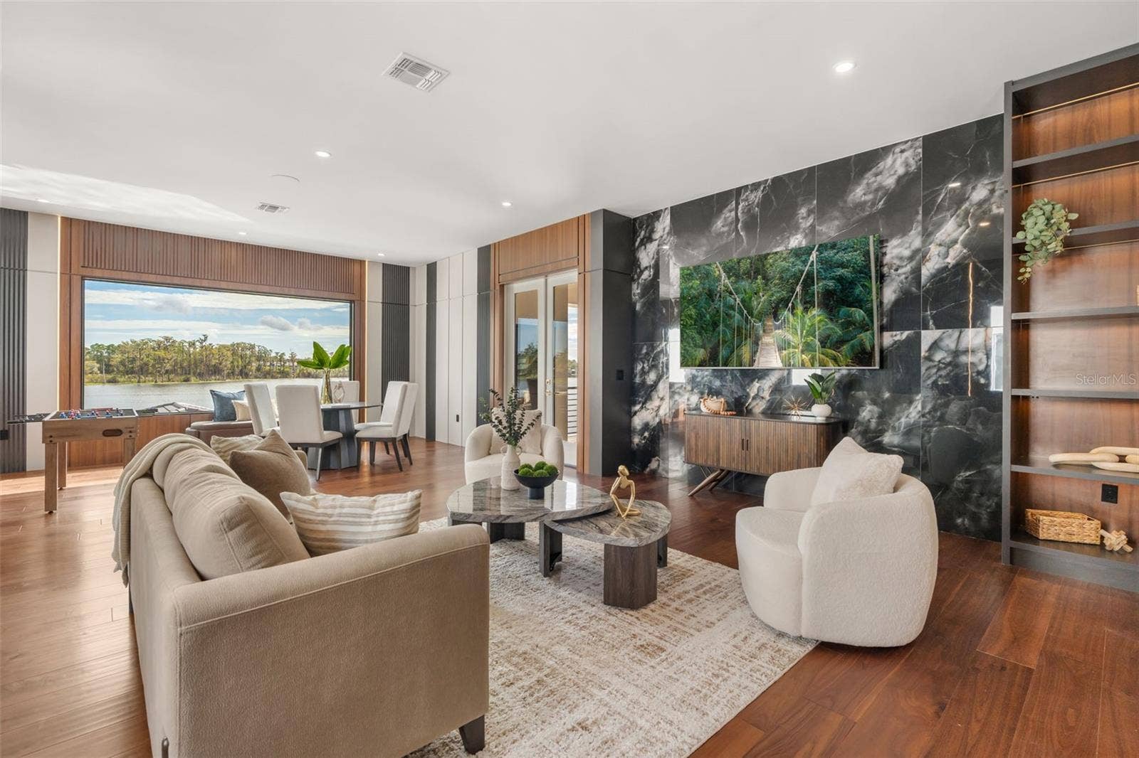 9117 BAY POINT DRIVE, Orlando, FL 32819 Enough space for a pool table or more lounge chairs for movie night