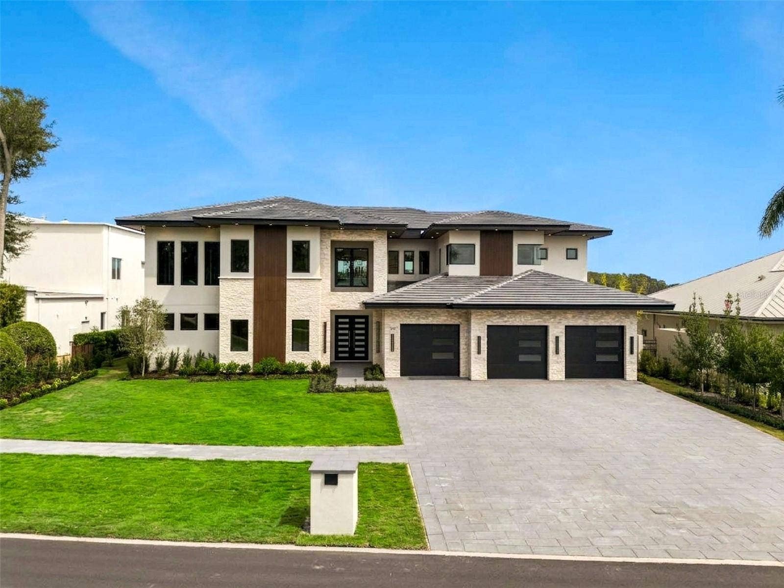 9117 BAY POINT DRIVE, Orlando, FL 32819 On a lakefront lot