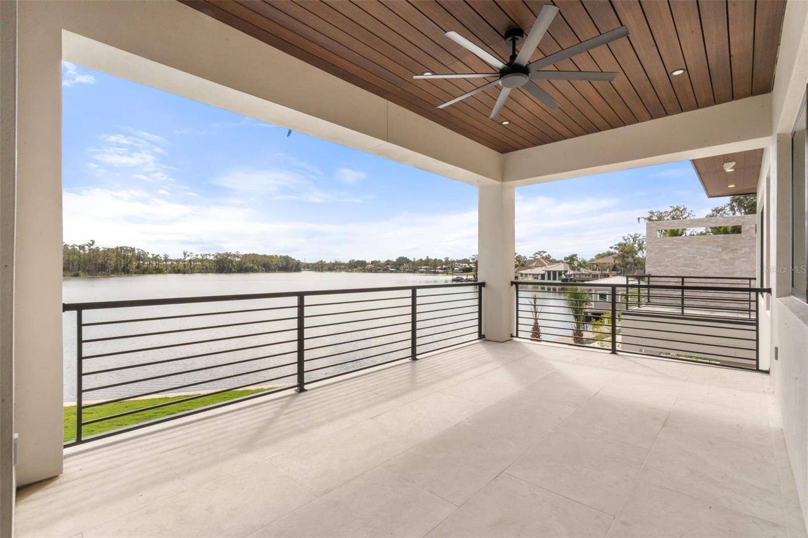 9117 BAY POINT DRIVE, Orlando, FL 32819 Balcony off the Entertaining Room with lake views