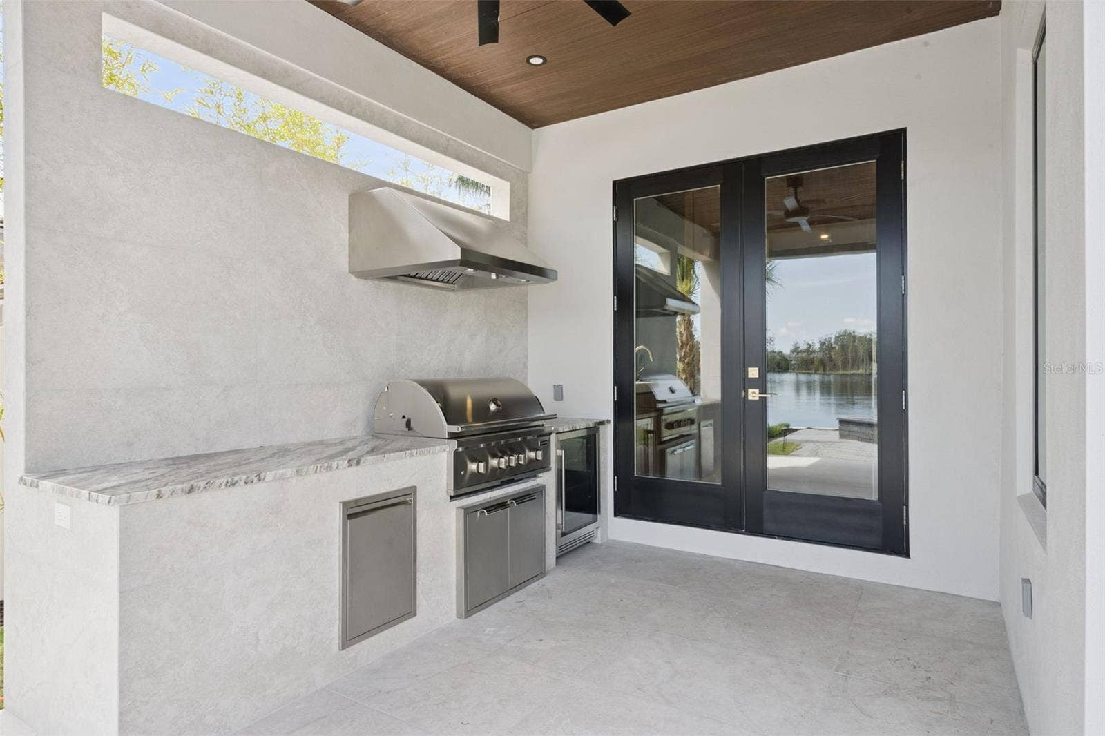 9117 BAY POINT DRIVE, Orlando, FL 32819 Outdoor Kitchen featuring grill and refrigerator