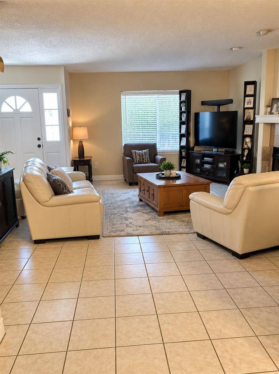 1061 ARAGON AVENUE, #1061, Winter Park, FL 32789 Living room. Tile floors on 1st floor