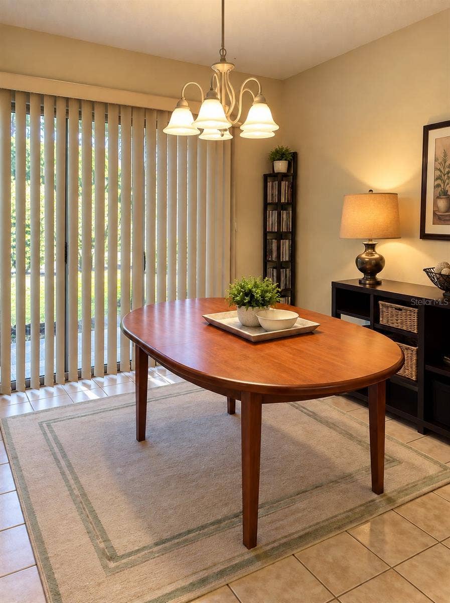 1061 ARAGON AVENUE, #1061, Winter Park, FL 32789 Dining room with sliding doors to the private patio