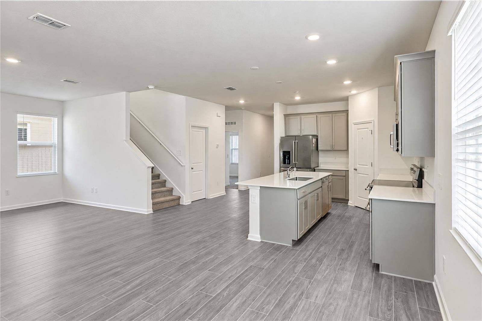 6459 PINE FORK ALLEY, St Cloud, FL 34771 Dinette and Kitchen, Second Floor Stairs and Closet Door
