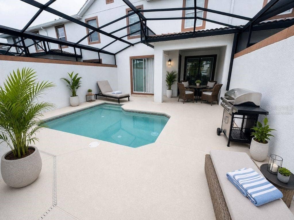 Virtually staged screened pool and patio highlighting a private outdoor retreat with space for lounging, dining, and entertaining.
