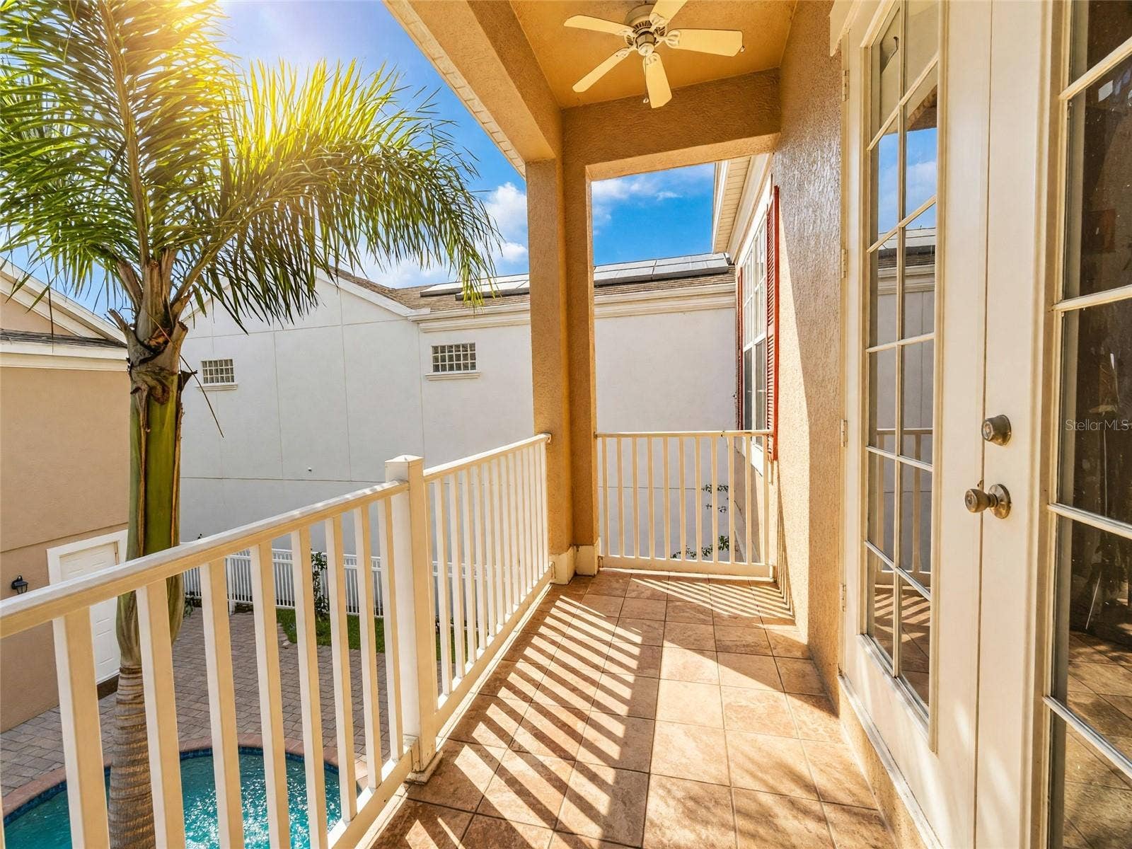 7526 EXCITEMENT DRIVE, Reunion, FL 34747 Balcony of Bedroom 3 Facing the Pool/Courtyard