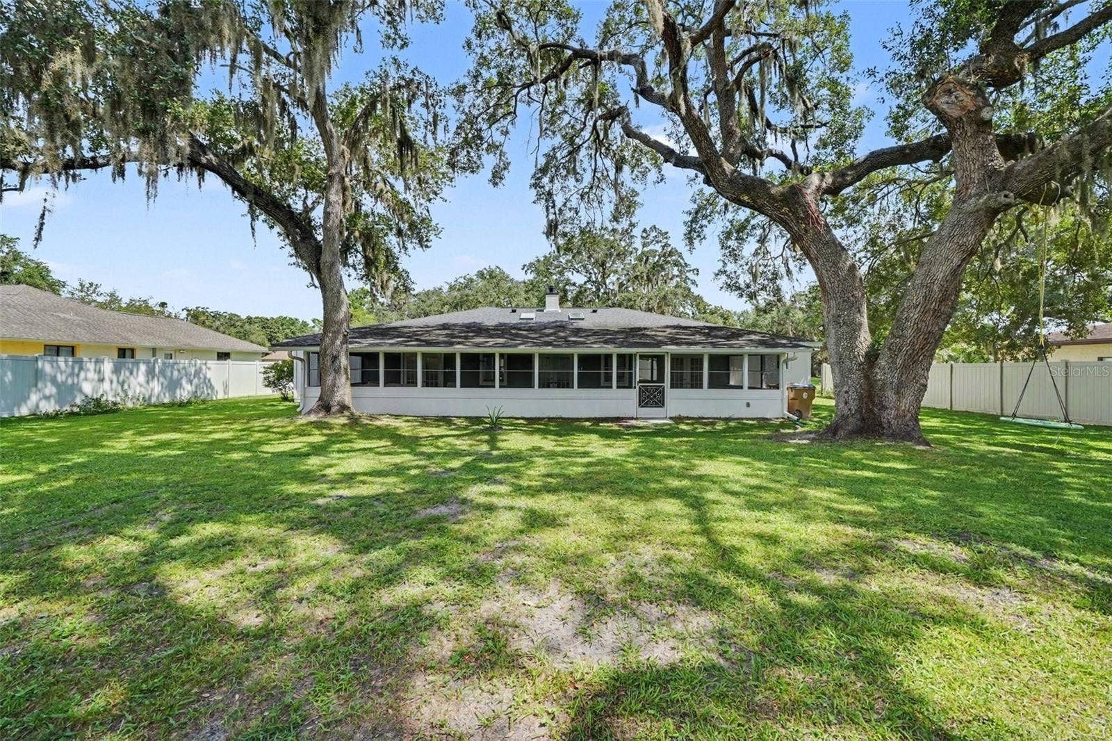 1592 SKYLINE DRIVE, Kissimmee, FL 34744 Screened Back Porch & Tranquil mostly fenced Back yard