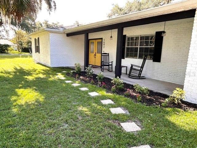 1592 SKYLINE DRIVE, Kissimmee, FL 34744 cute front porch and landscaping