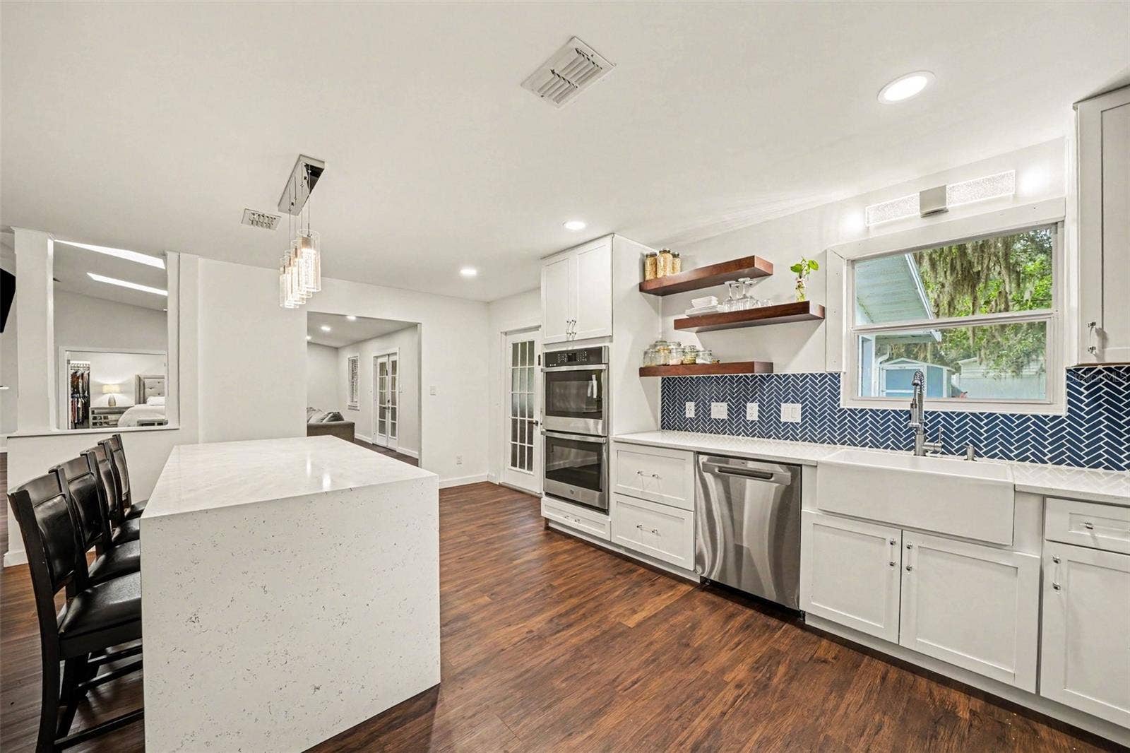 1592 SKYLINE DRIVE, Kissimmee, FL 34744 Gorgeous Kitchen with decorative blue tile backsplash & double Oven