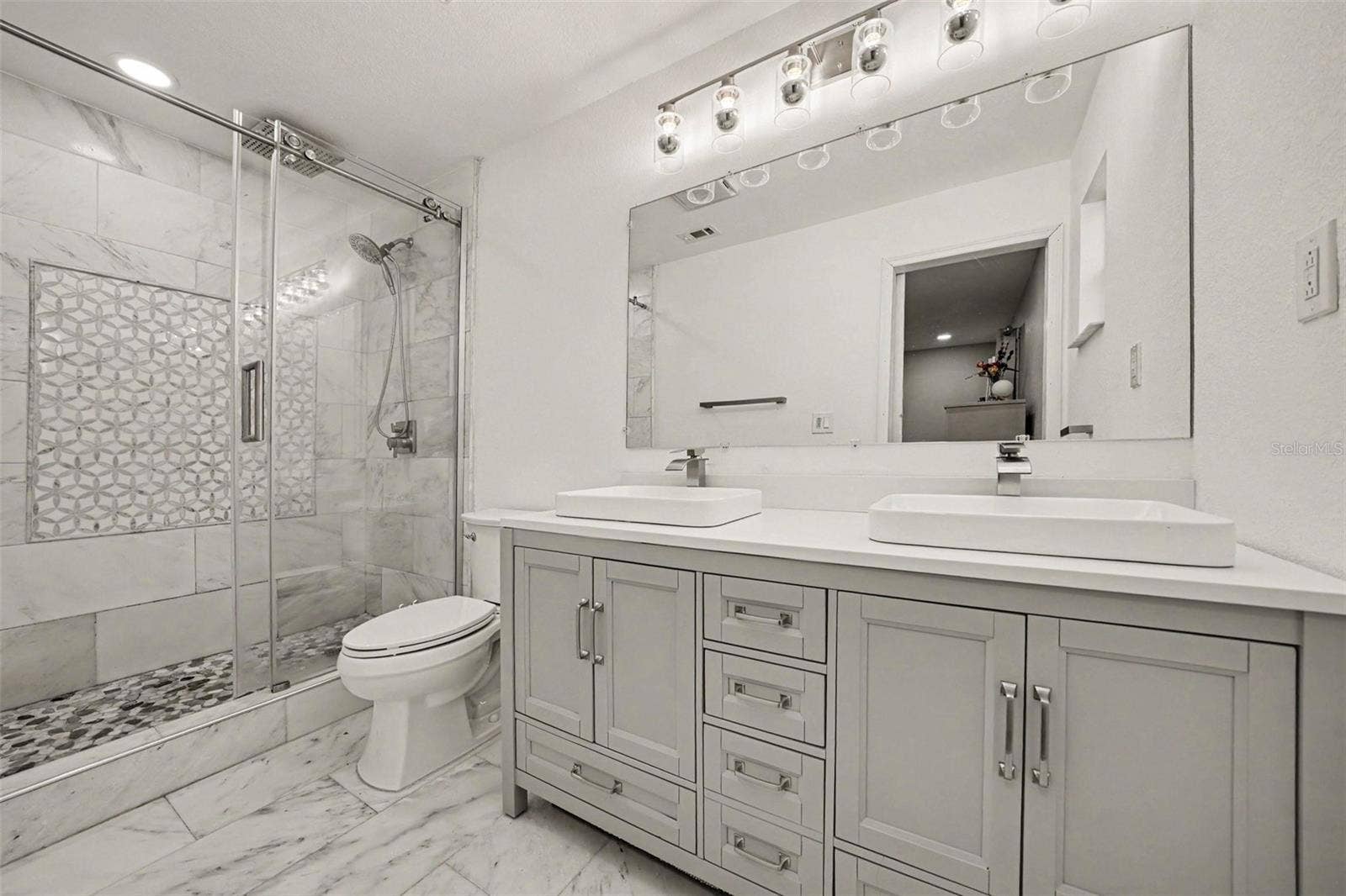 1592 SKYLINE DRIVE, Kissimmee, FL 34744 Primary Bath w/Marble tiled walk-in shower, marble tiled flooring and vanity w/ double sinks