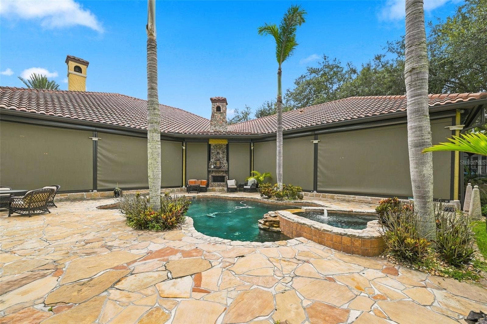 9679 WESTOVER ROBERTS RD, Windermere, FL 34786 Nerwly installed Remote Hurricane Screen Shutters