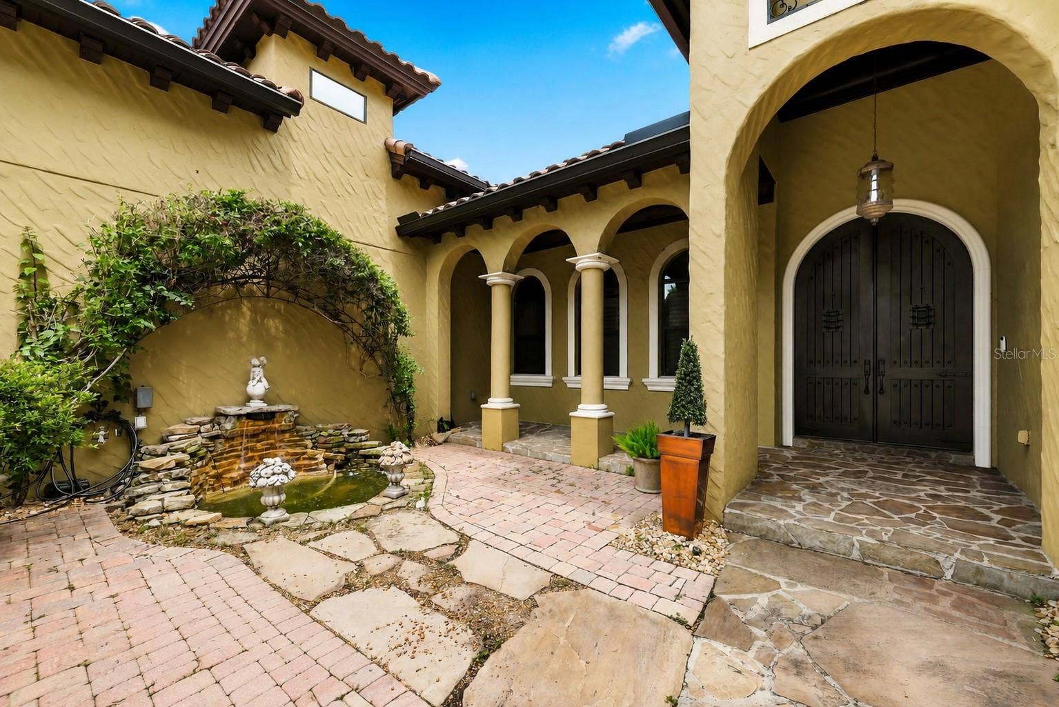 9679 WESTOVER ROBERTS RD, Windermere, FL 34786 Fountain to front Courtyard