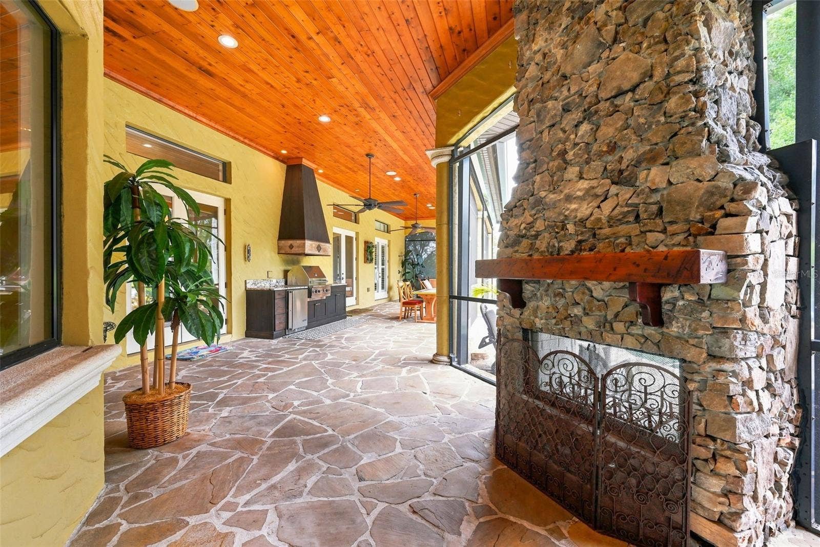 9679 WESTOVER ROBERTS RD, Windermere, FL 34786 Screened In Lanai With Fireplace