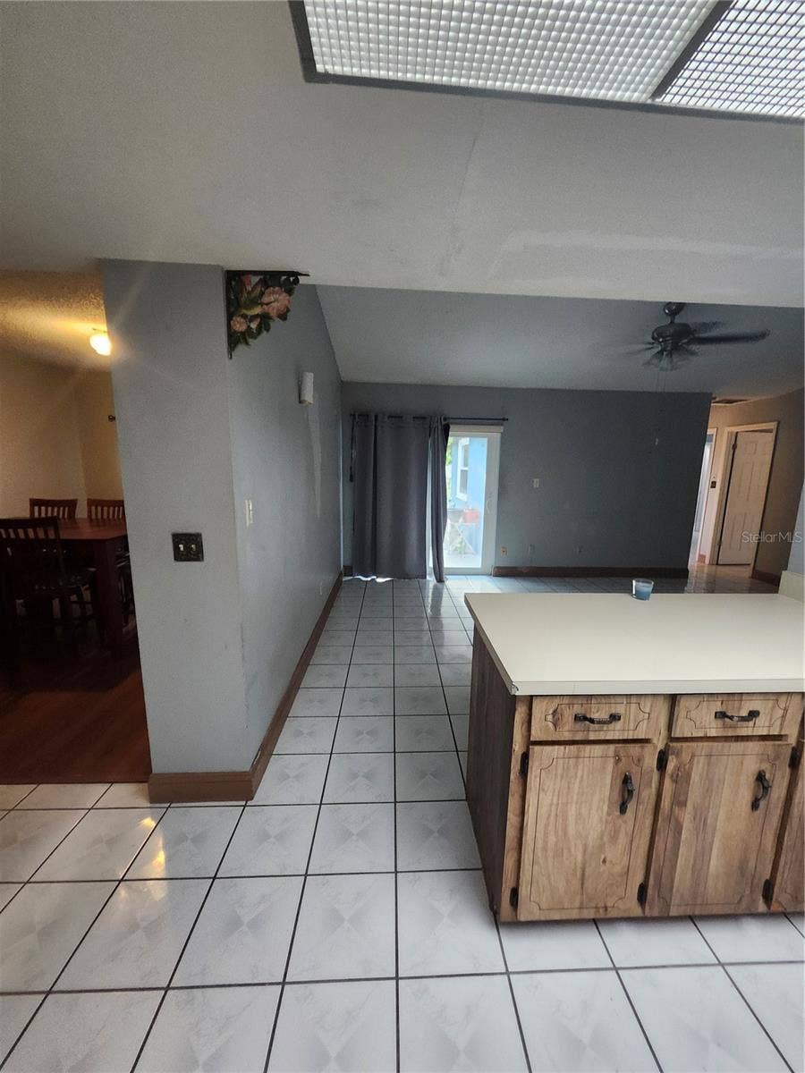 Orlando, FL 32836 KITCHEN VIEW OF FAMILY ROOM AND FORMAL DINING ROOM