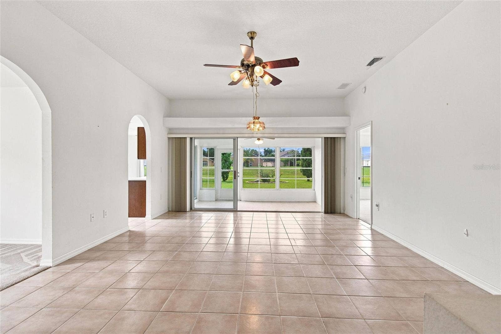 347 ROYAL PALM DR, Davenport, FL 33837 Tile floor in Great Room and Lanai