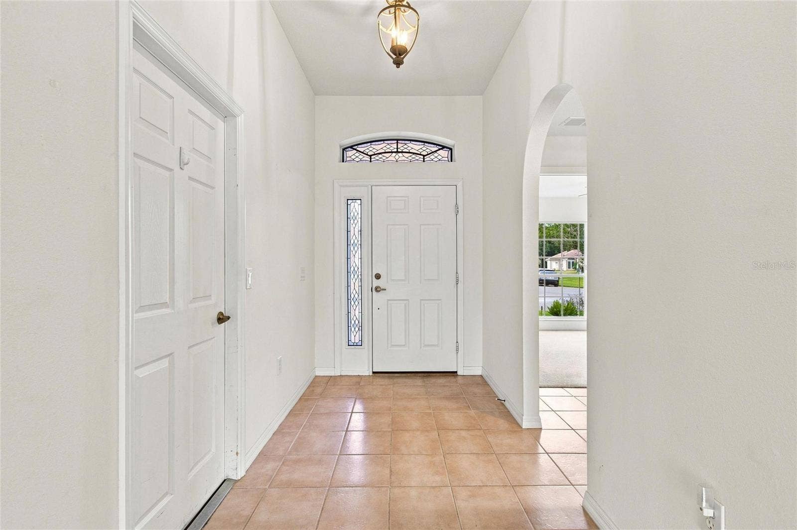 347 ROYAL PALM DR, Davenport, FL 33837 Leaded-glass sidelight and overhead window inserts custom-made by a High Vista artisan