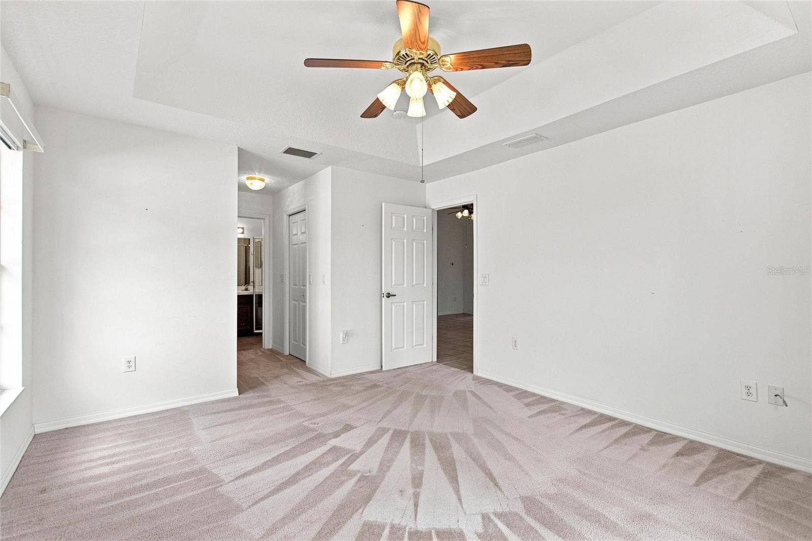 347 ROYAL PALM DR, Davenport, FL 33837 Primary en suite bedroom has 2 walk-in closets