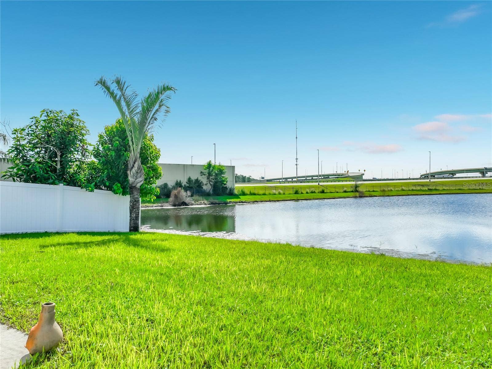 12900 LOS ALAMITOS COURT, Orlando, FL 32837 Back yard on pond front. So calming!