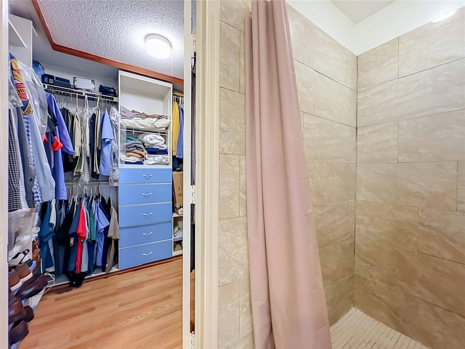 12900 LOS ALAMITOS COURT, Orlando, FL 32837 Walk in closet is next to the shower