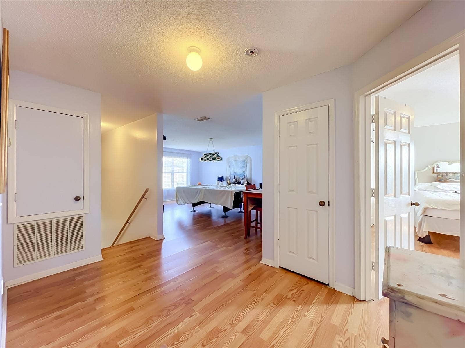 12900 LOS ALAMITOS COURT, Orlando, FL 32837 Wood laminate floors at landing on 2nd floor