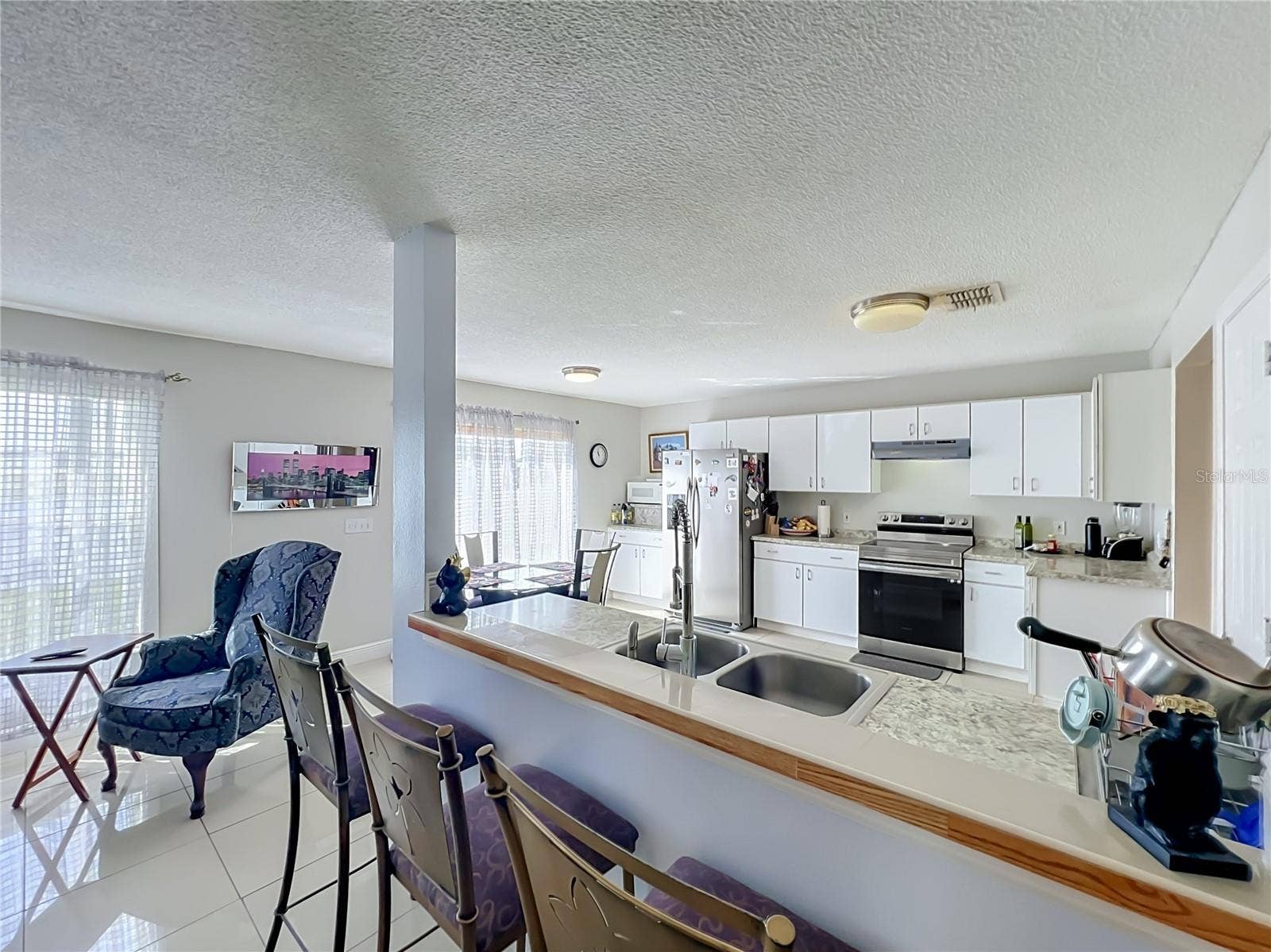 12900 LOS ALAMITOS COURT, Orlando, FL 32837 Kitchen is open to the family room