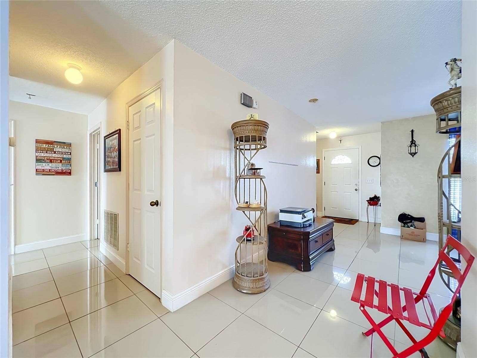 12900 LOS ALAMITOS COURT, Orlando, FL 32837 And off to the right is the entrance to the 1st floor Primary bedroom